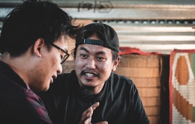 a couple of men standing next to each other