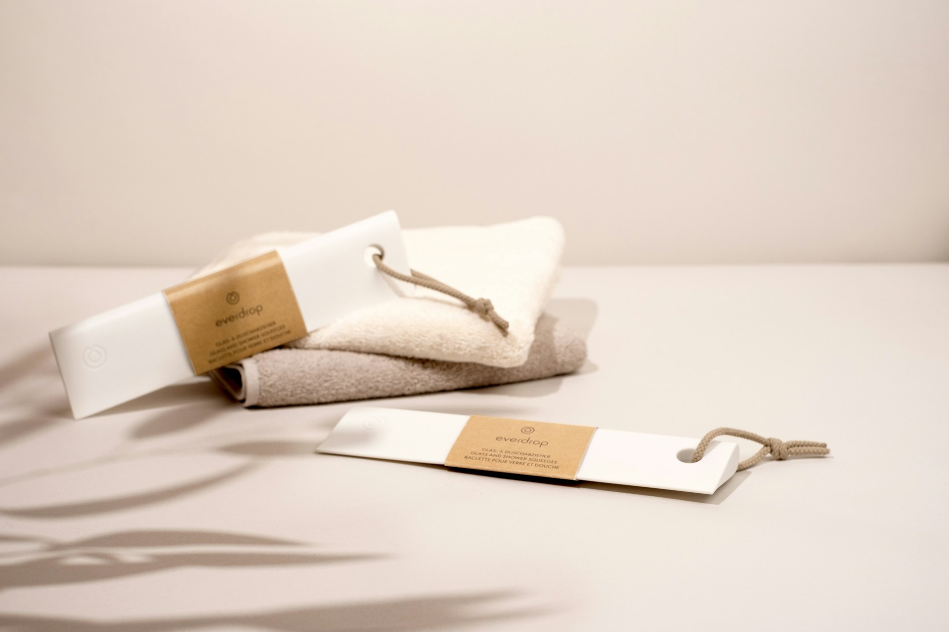 a towel and a bottle of lotion sitting on a table