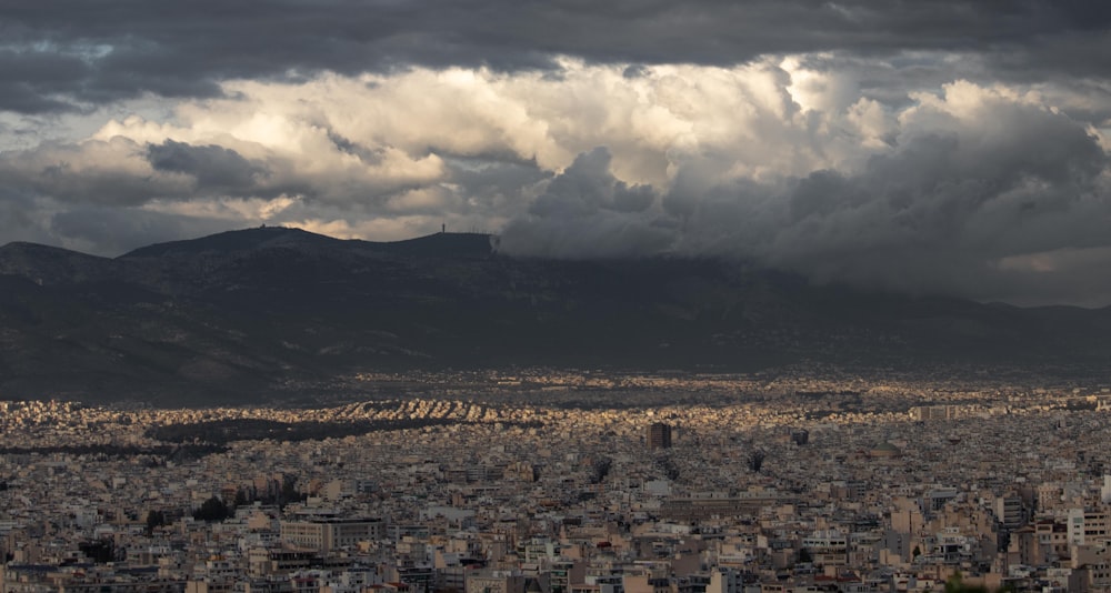 a view of a city with mountains in the background