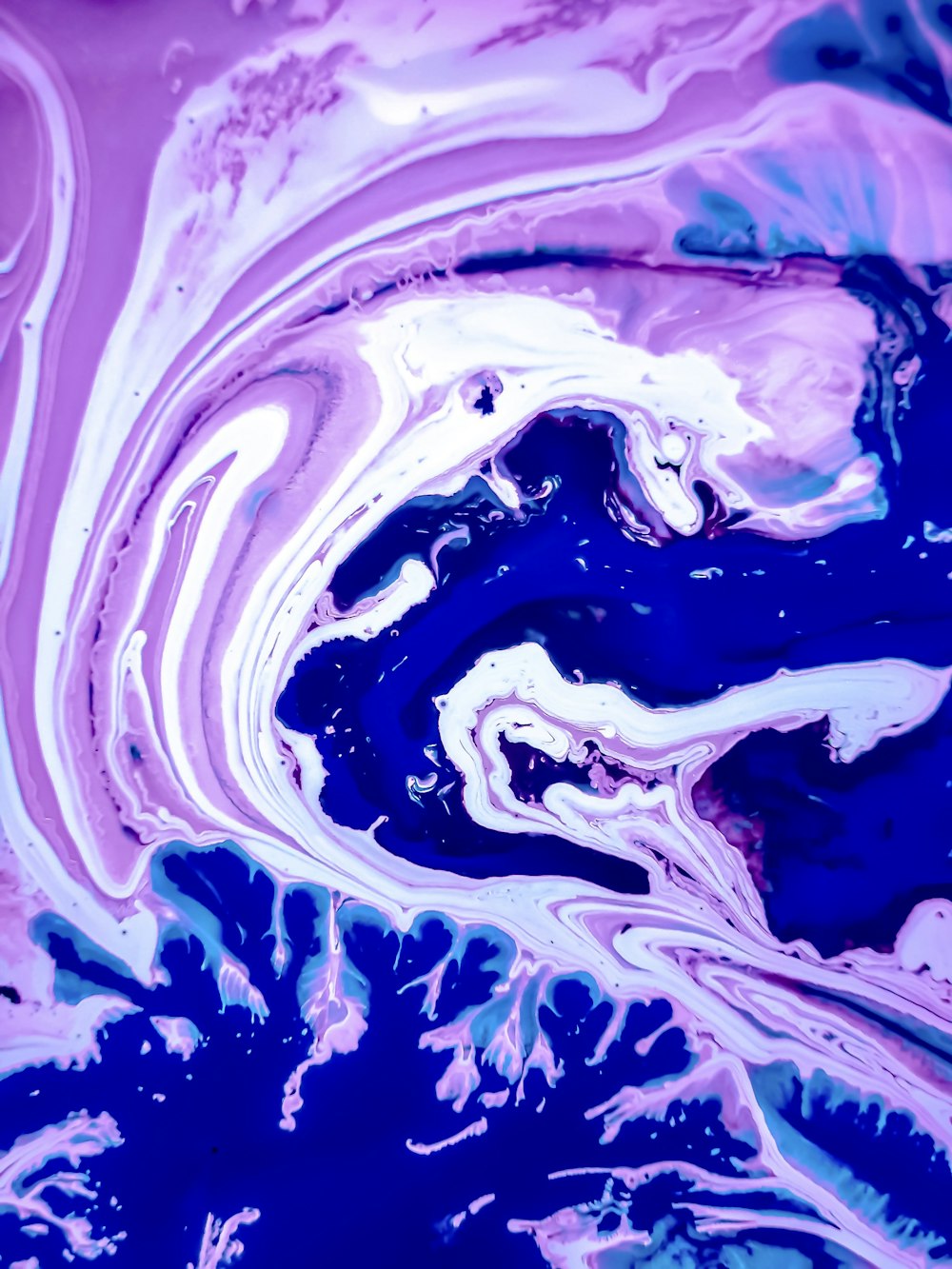 a close up of a blue and purple liquid