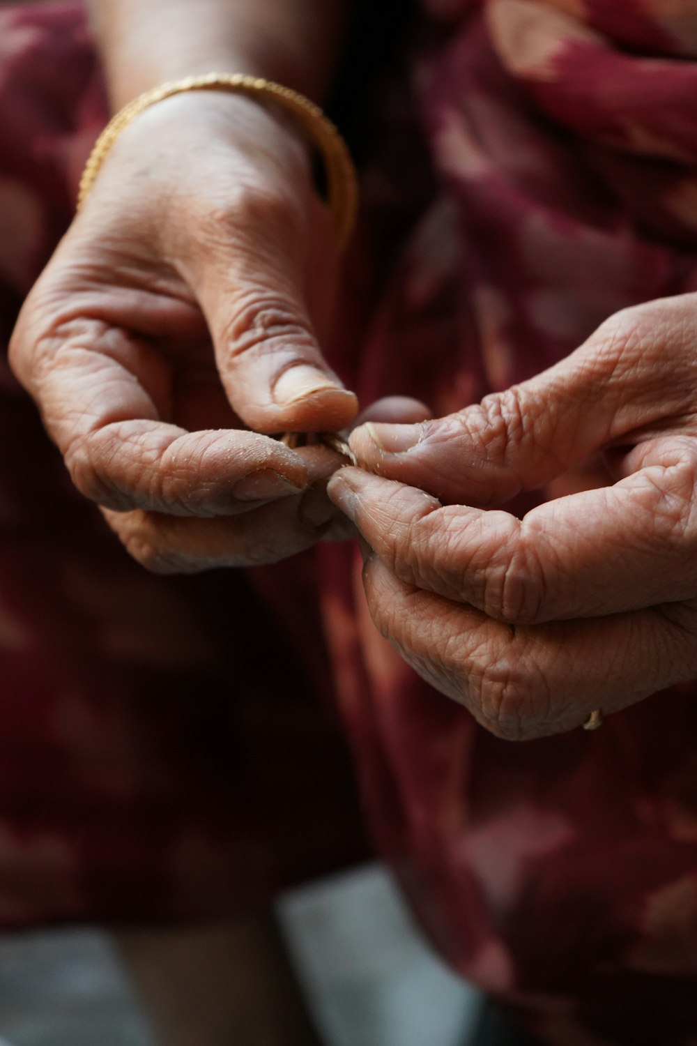 a woman holding a piece of silverware in her hands