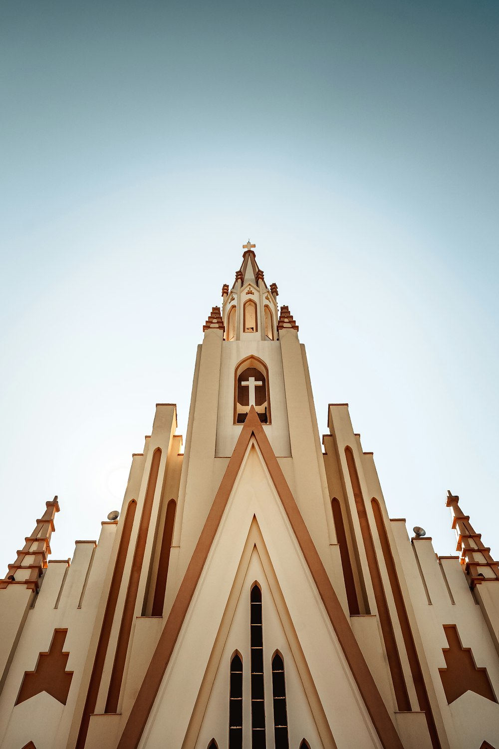 a church steeple with a cross on the top