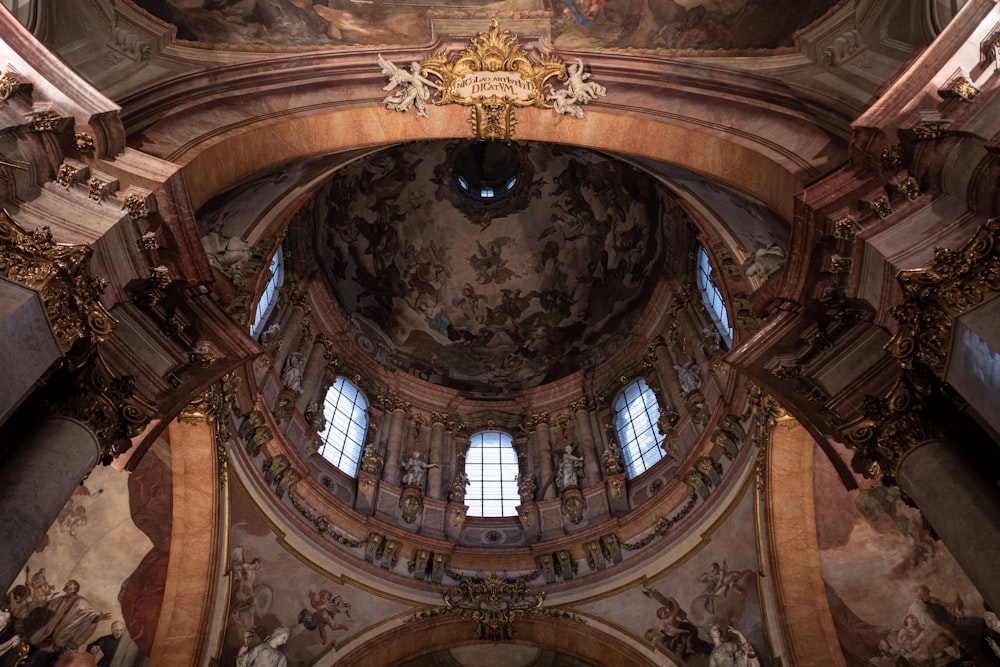 the ceiling of an old church with paintings on it