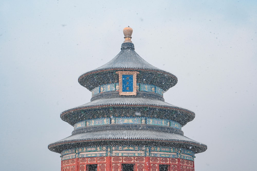 a tall tower with a clock on the top of it