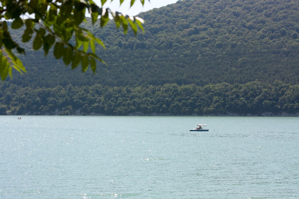 a small boat in a large body of water