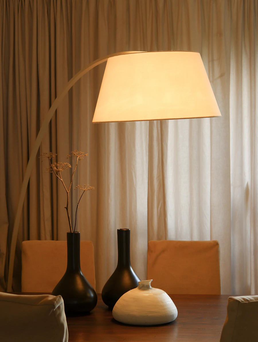 Side table with two vases and a lamp