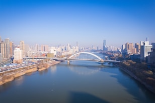 a river running through a city next to tall buildings