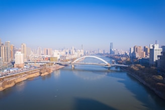 a river running through a city next to tall buildings