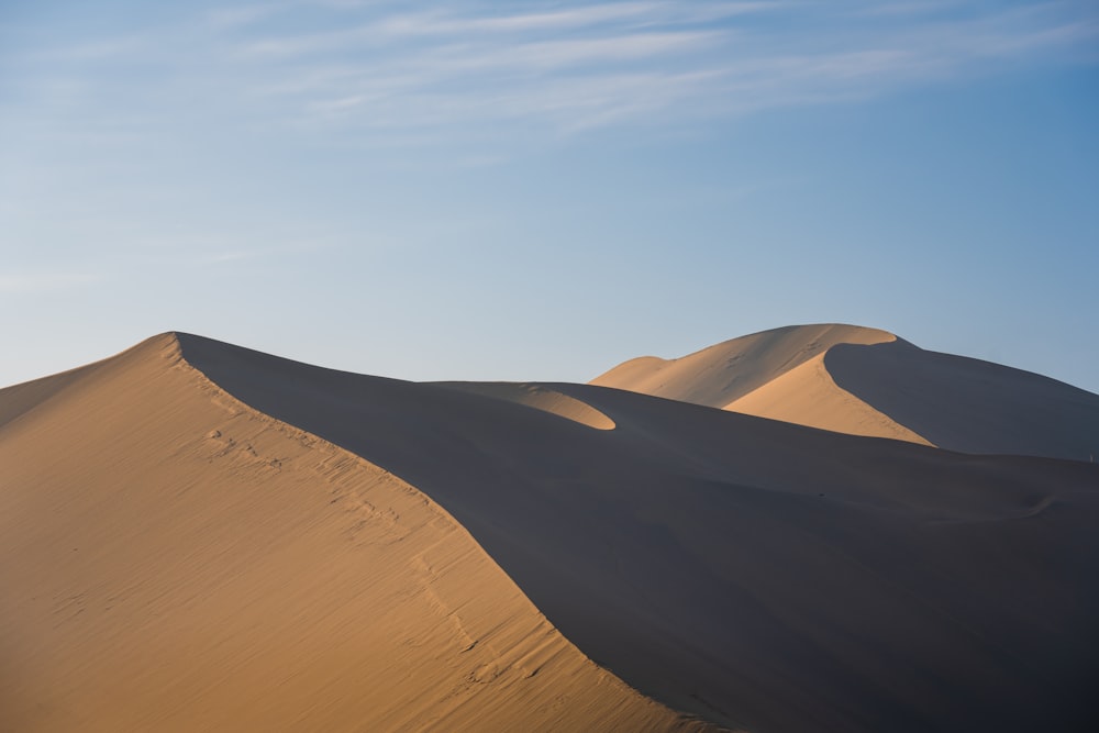 a group of sand dunes in the desert