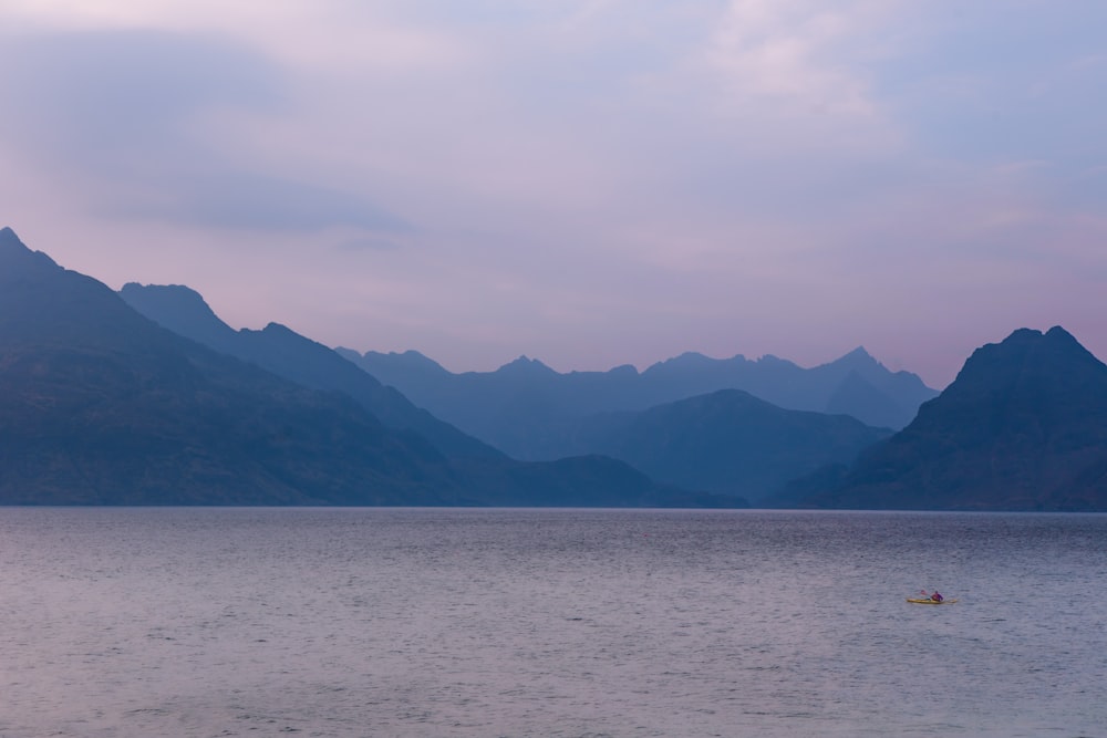 a person in a kayak on a large body of water