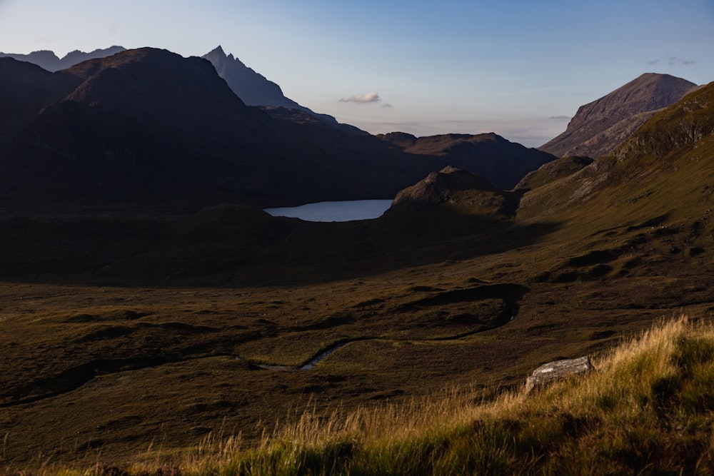 a mountain range with a lake in the middle of it