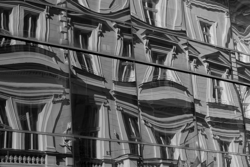 a reflection of a building in a glass window