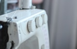 a close up of a sewing machine with buttons