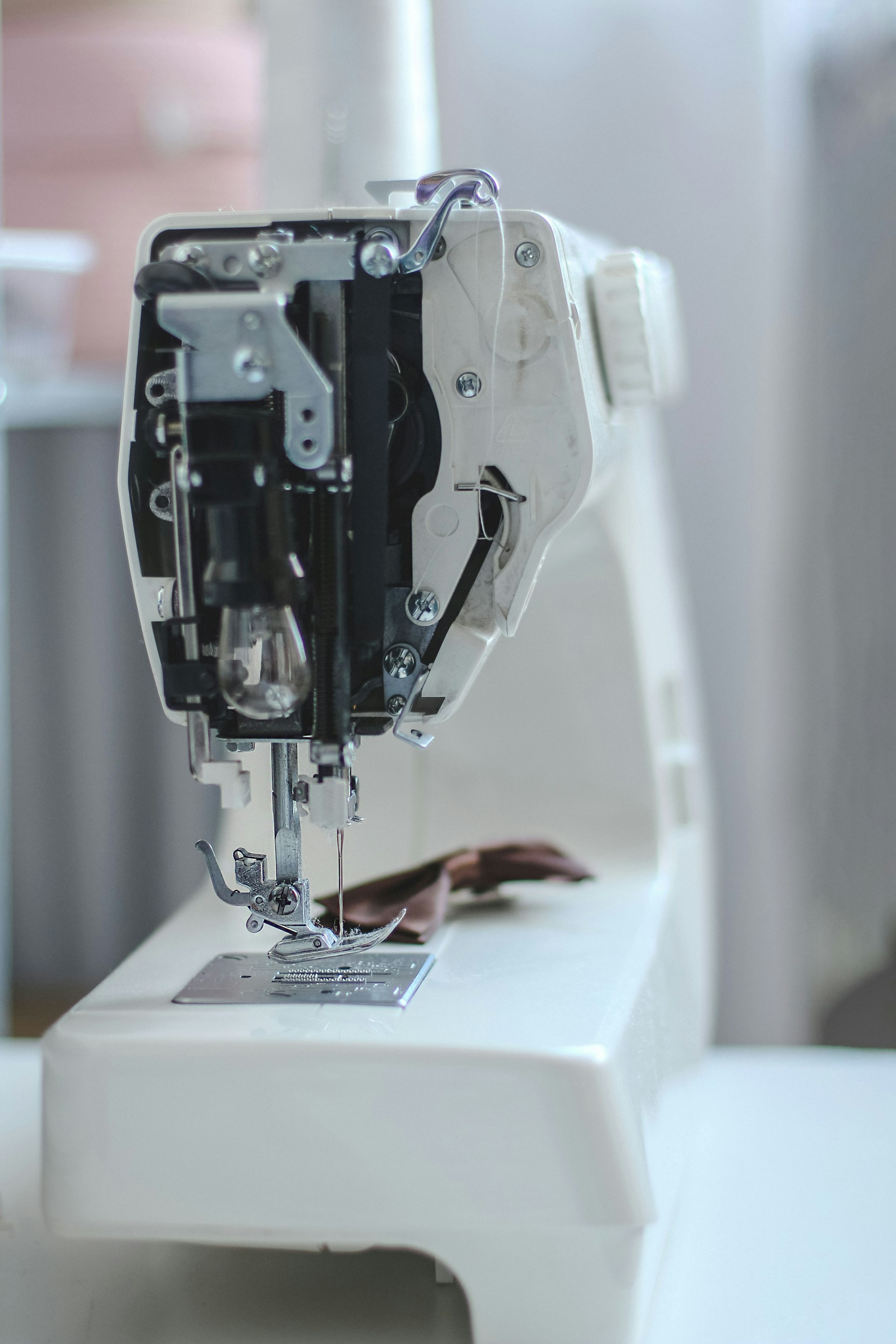 a close up of a sewing machine on a table
