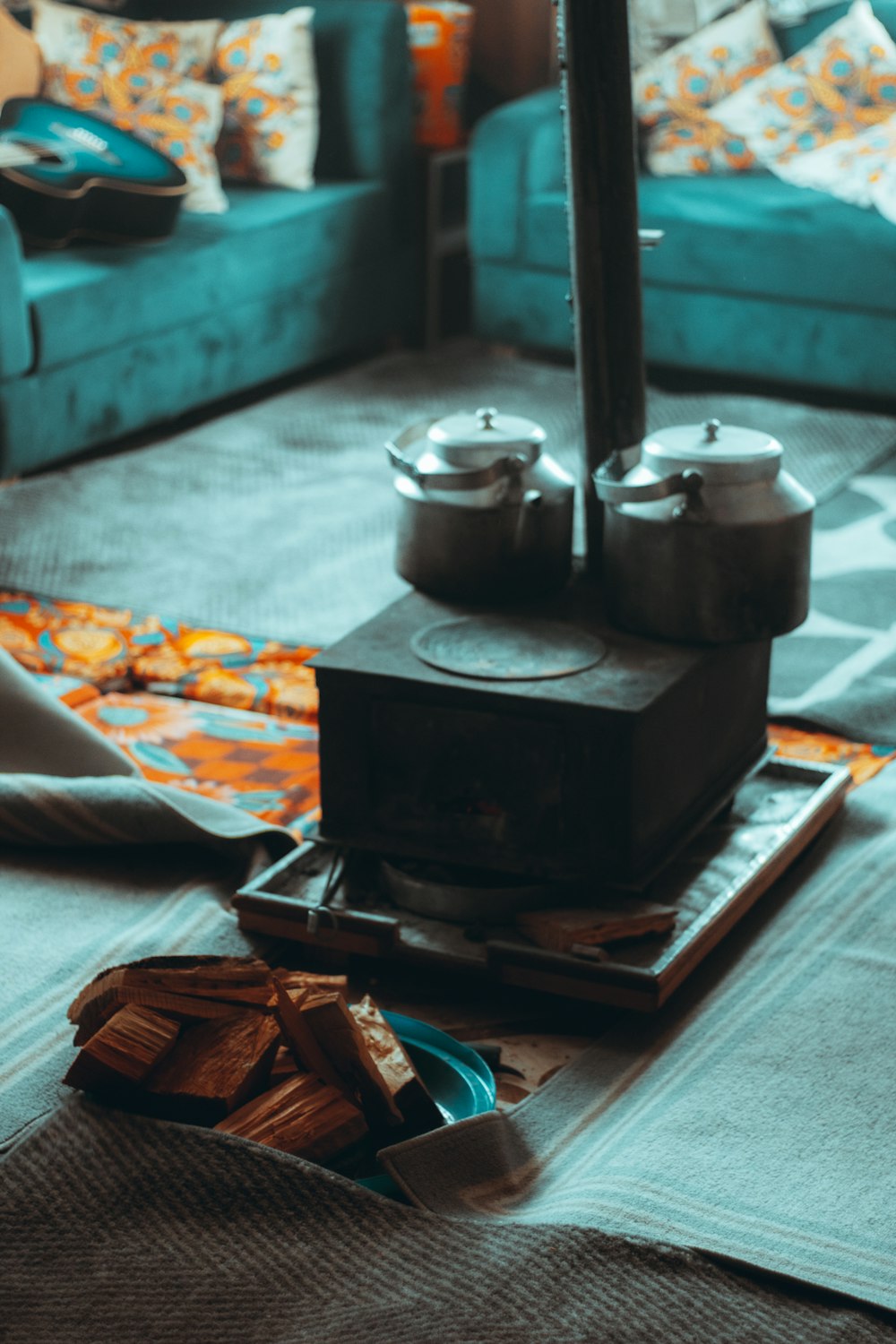 a living room filled with furniture and a blue couch