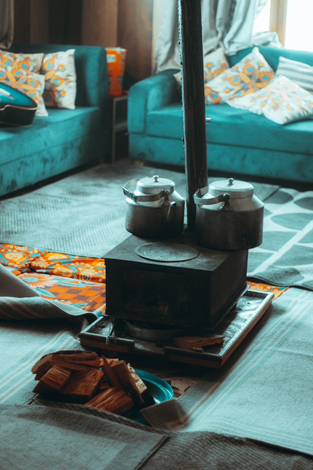 a living room filled with furniture and a blue couch