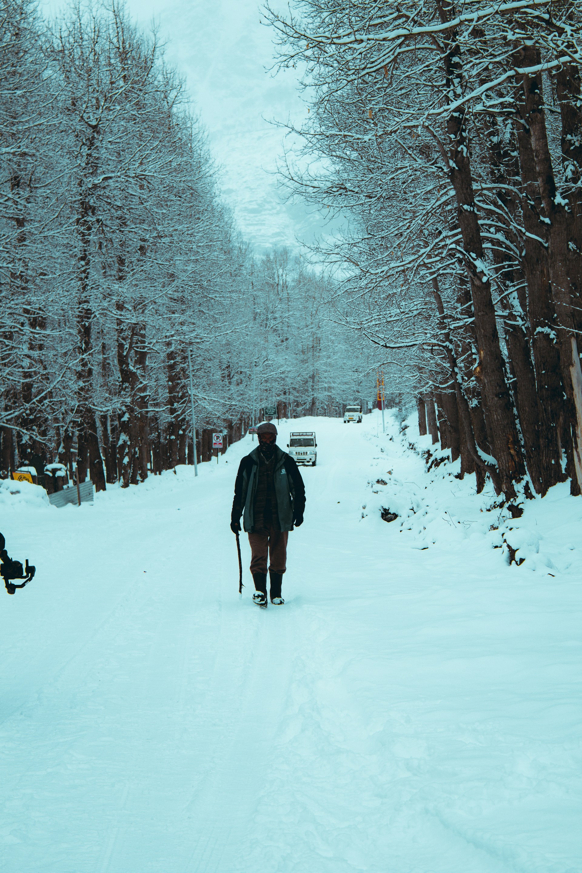 a person walking in the snow on skis