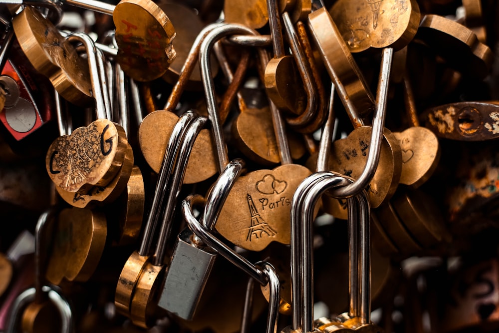 a bunch of padlocks that are attached to a wall