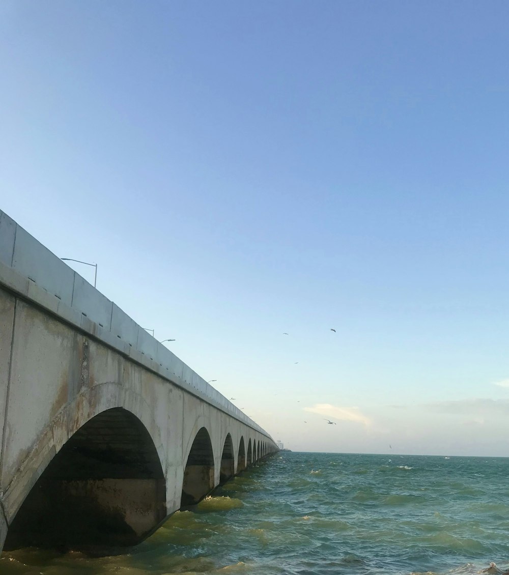 a concrete bridge over a body of water