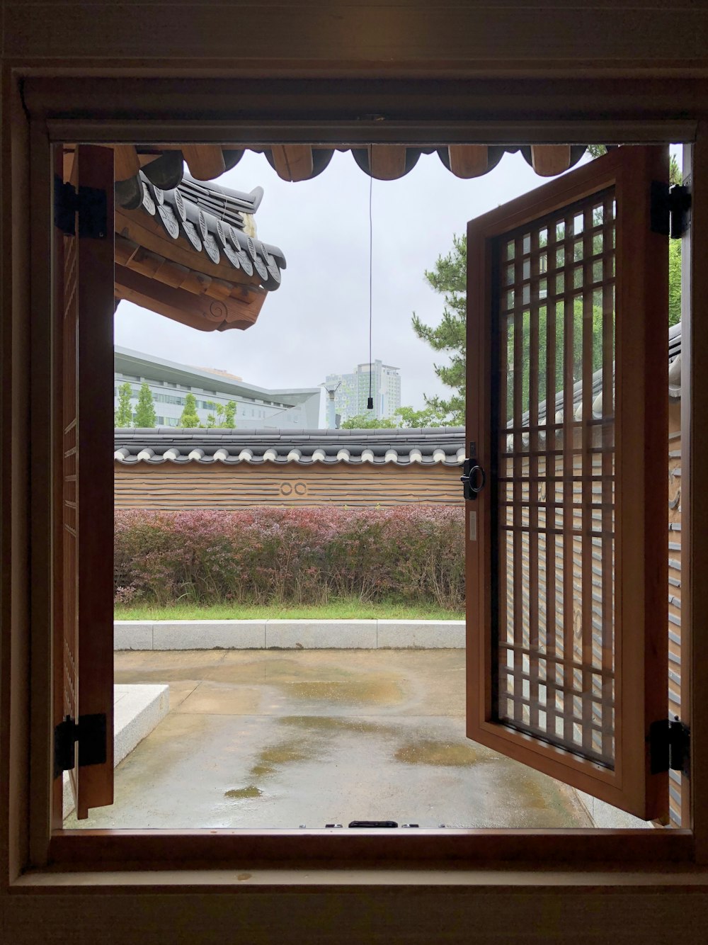 an open window with a view of a building