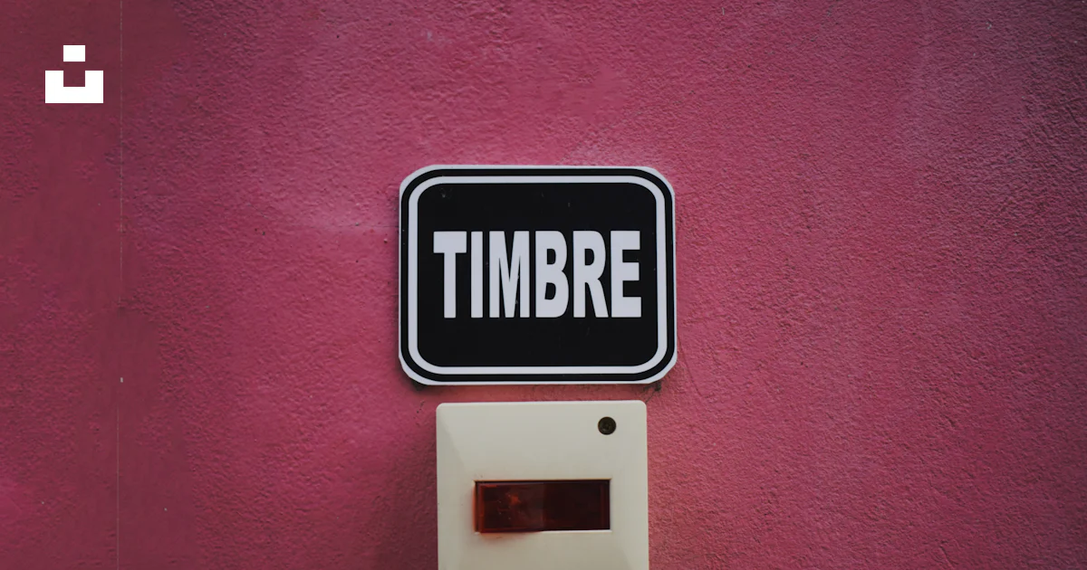 Timbrere A sign on a pink wall that says timbre photo – Free Label Image on Unsplash
