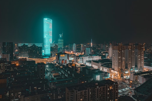 a view of a city at night from the top of a building