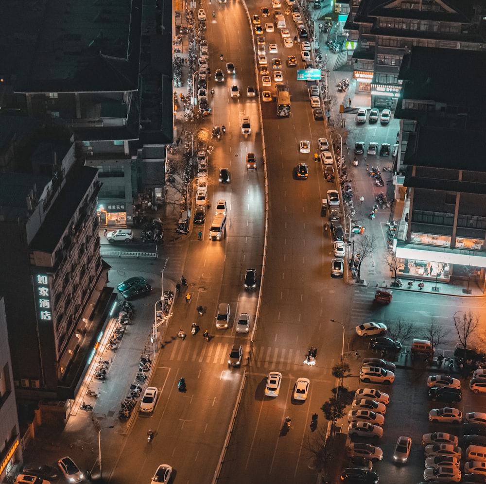 a city street filled with lots of traffic at night