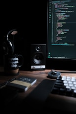 a computer desk with a keyboard, mouse and monitor