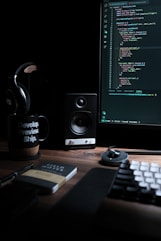 a computer desk with a keyboard, mouse and monitor