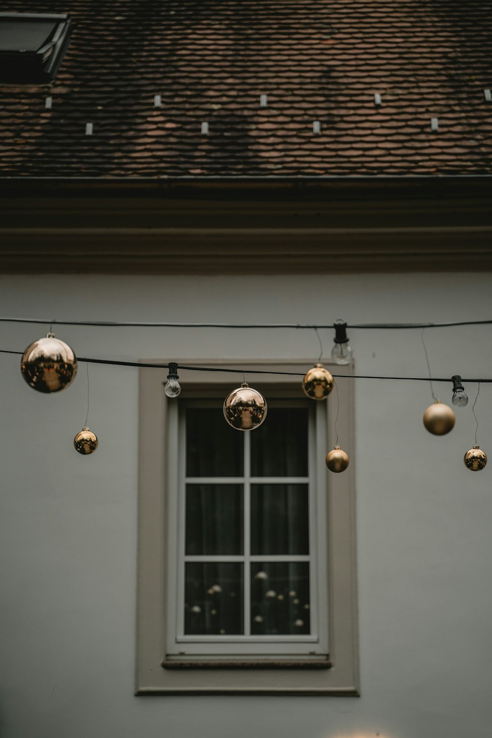 a building with a bunch of lights hanging from it's side