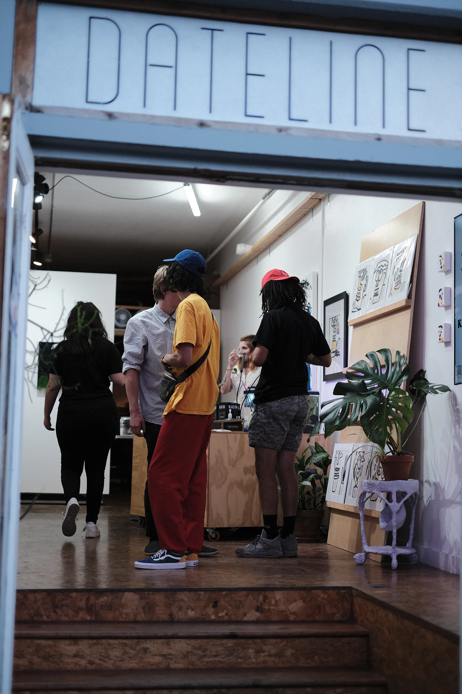 Customers gathered at a dispensary counter, the queue that automated limit checks and tax math keep moving
