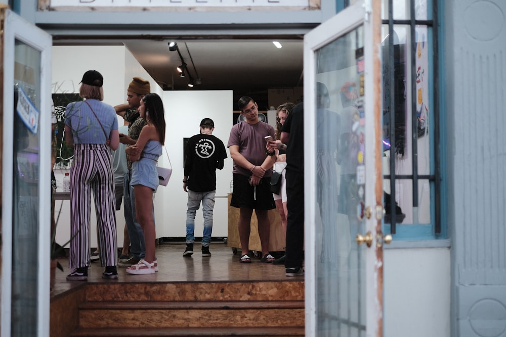 a group of people standing outside of a building