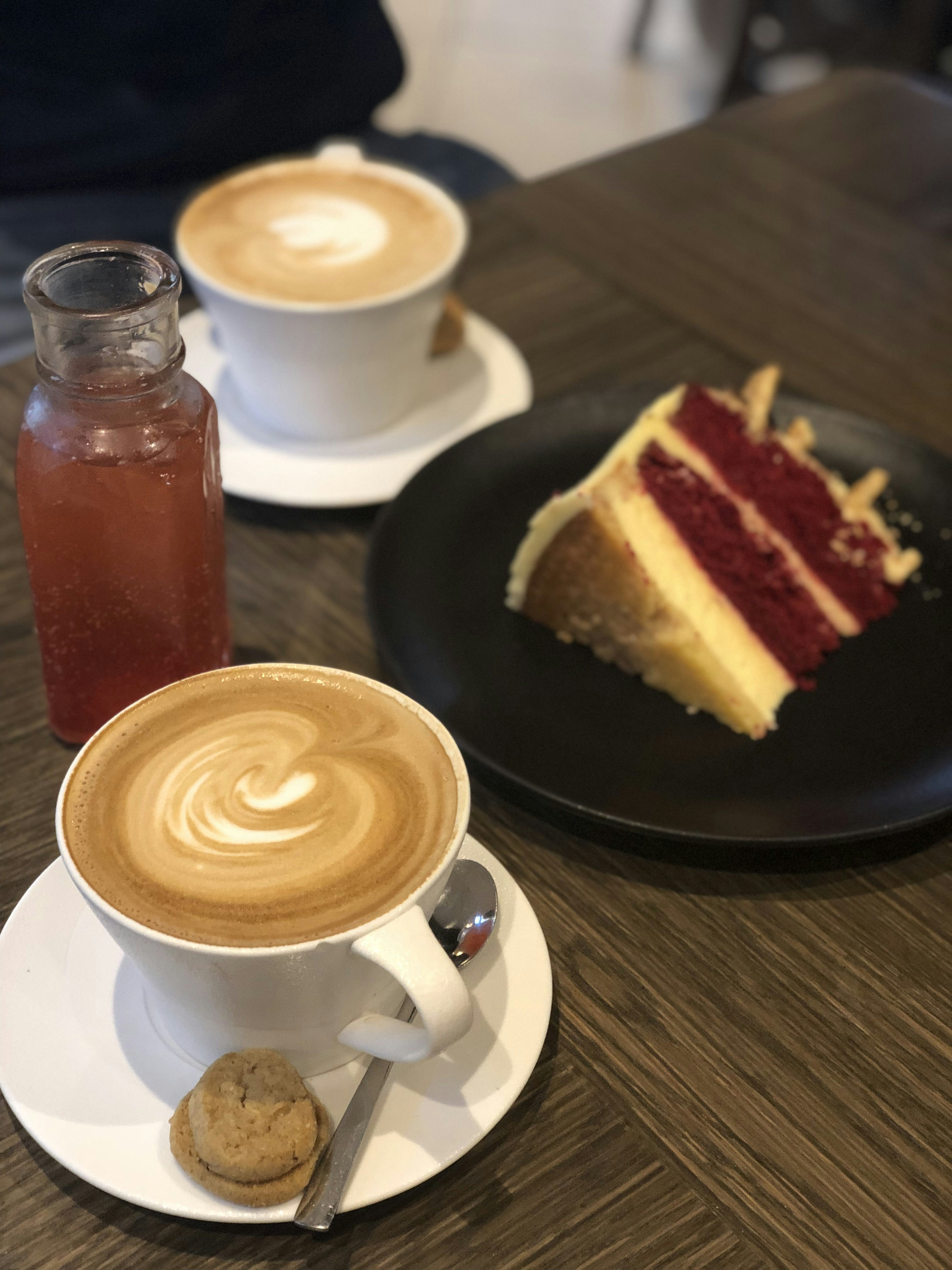 a slice of cake and a cup of coffee on a table