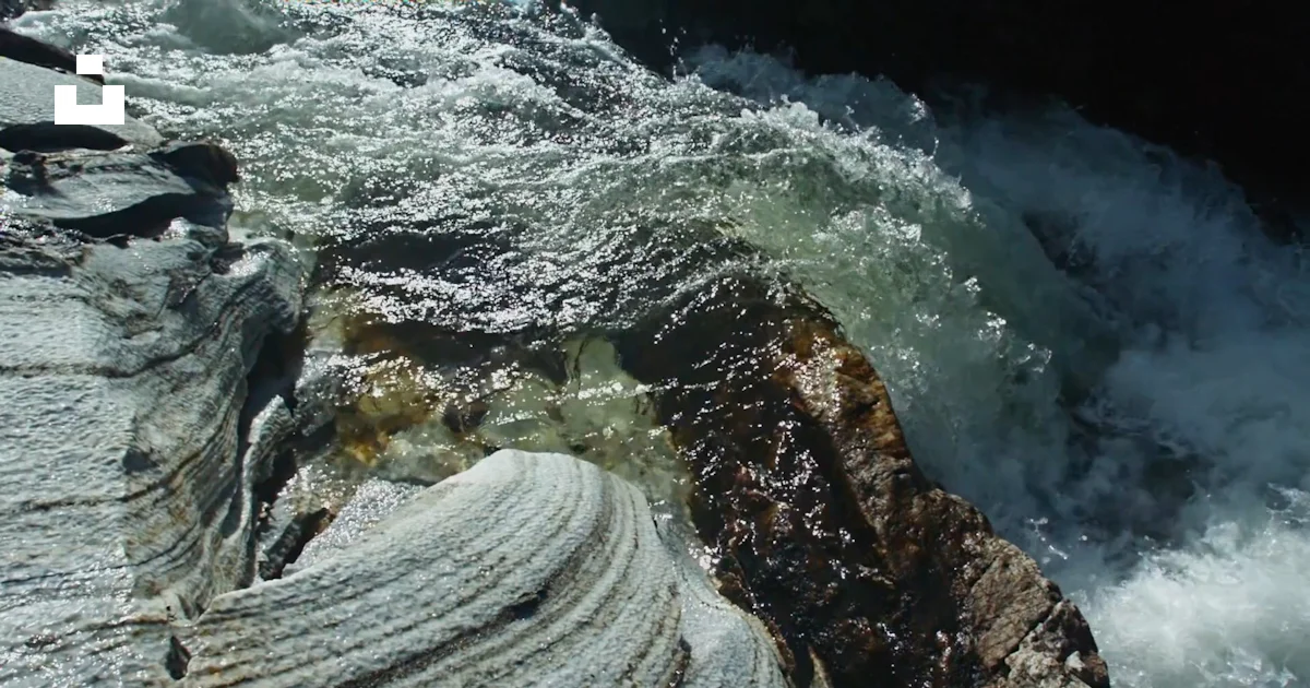 The water is rushing over the rocks in the river photo – Free Sea Image ...