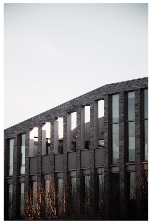 a tall building with lots of windows on top of it