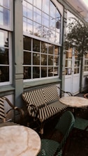 a table and chairs outside of a building