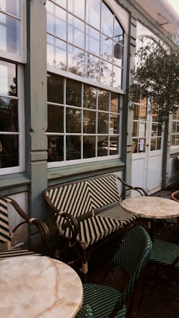 a table and chairs outside of a building