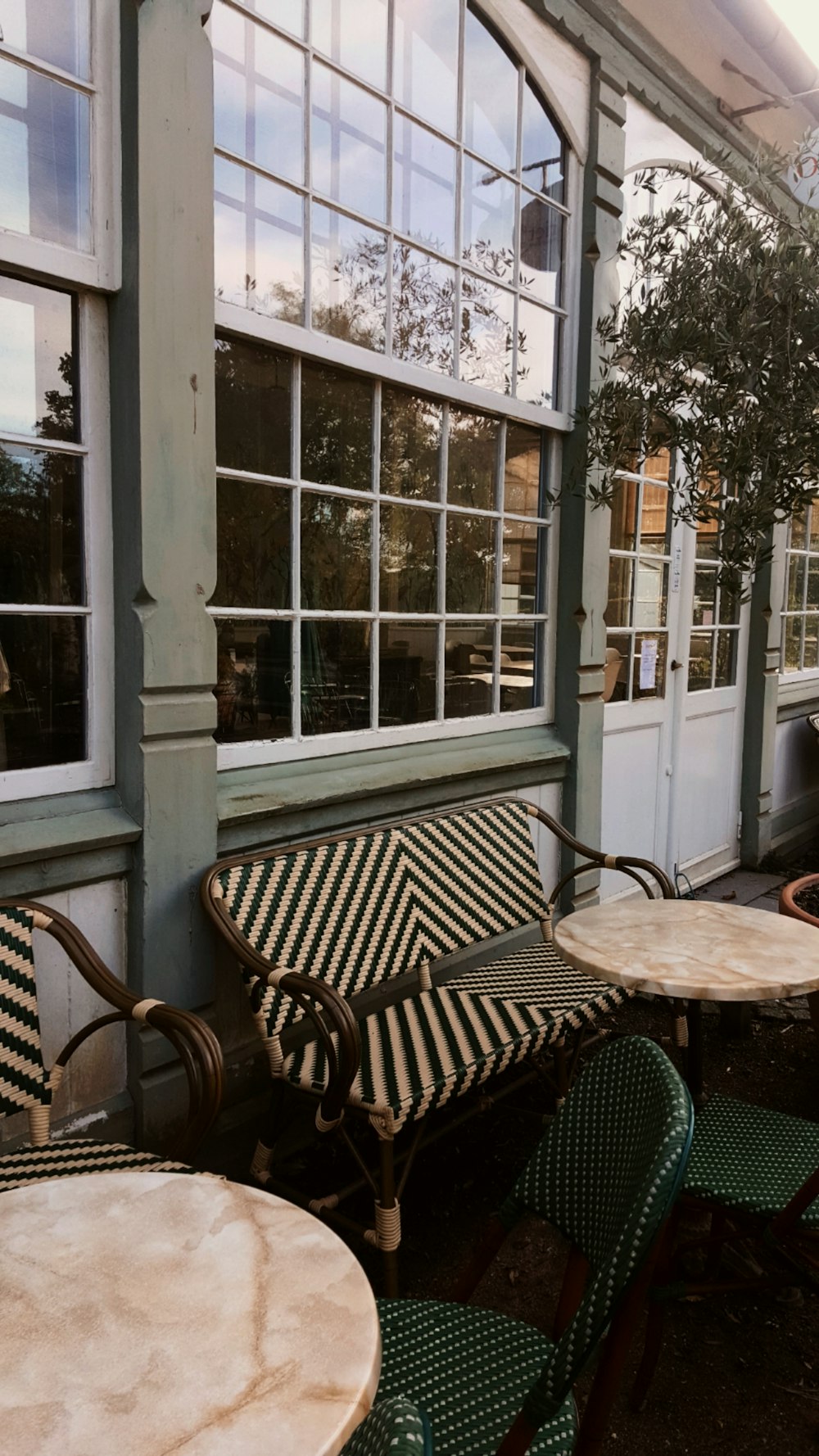 a table and chairs outside of a building