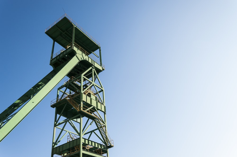 a tall metal structure with a sky background