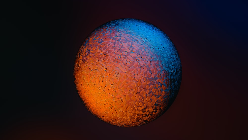 a close up of a blue and orange object