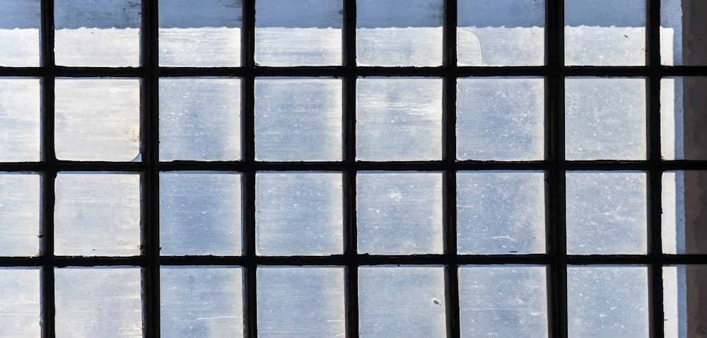 a close up of a window with bars on it