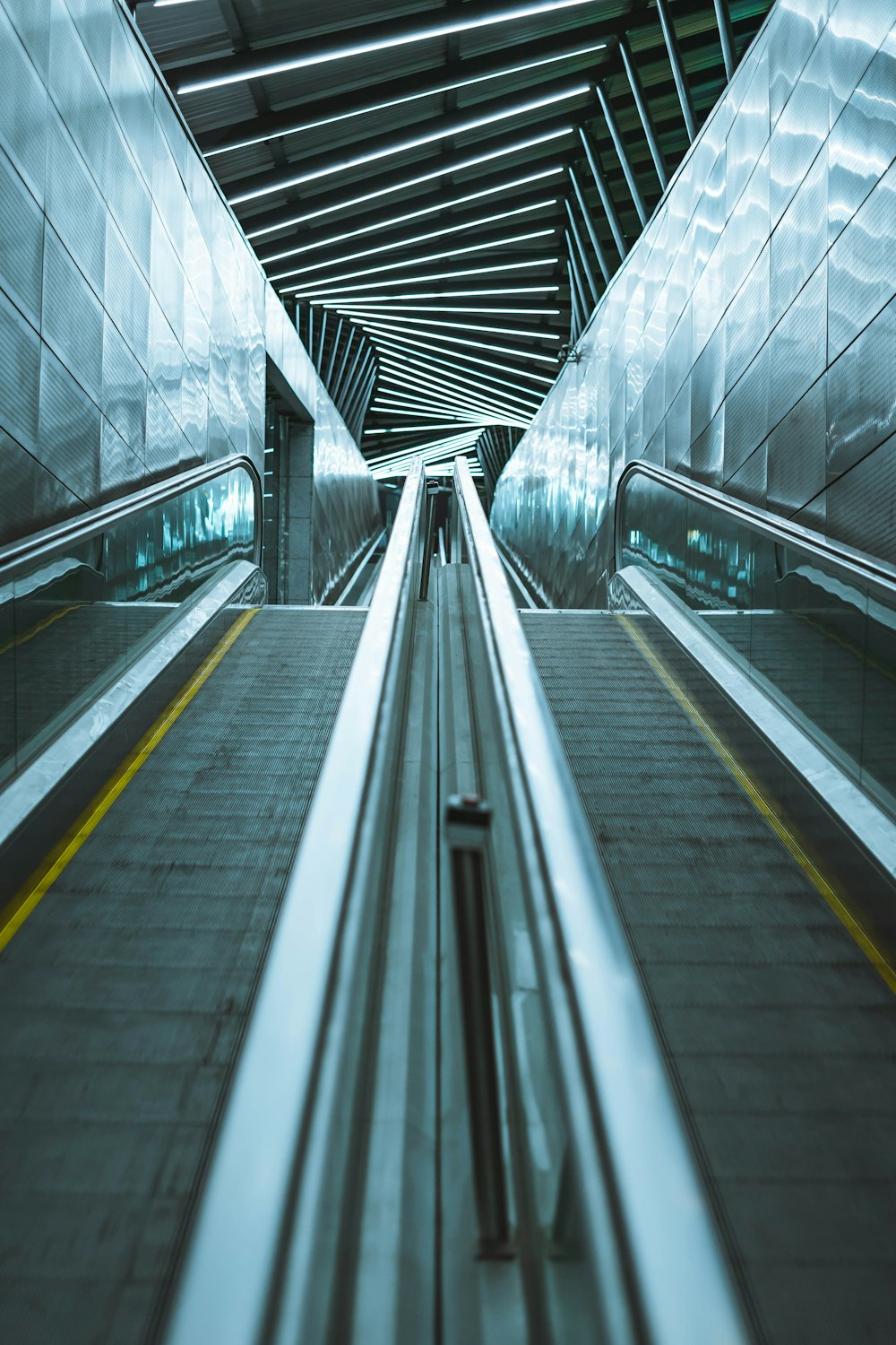 an empty escalator in a subway station