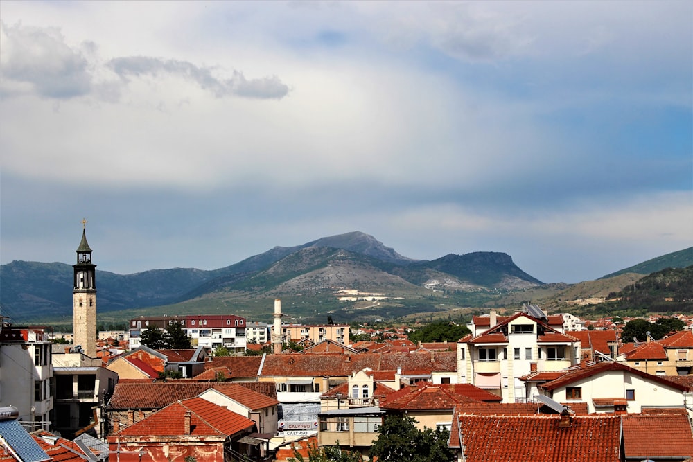 a view of a city with mountains in the background