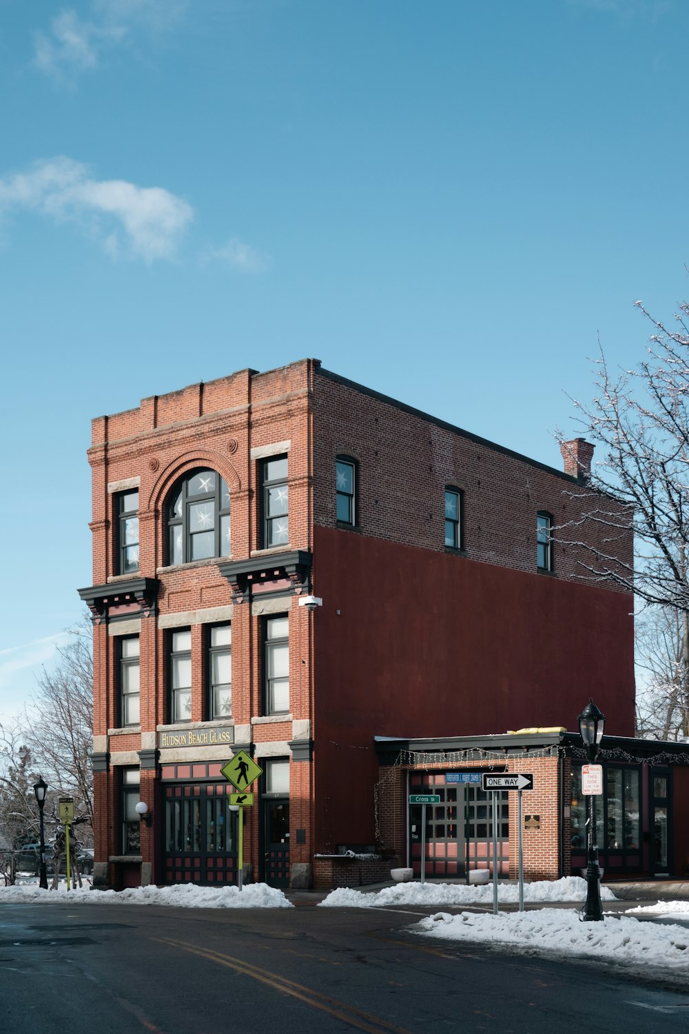 a red brick building sitting on the corner of a street