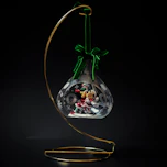a glass ornament with a christmas scene inside of it