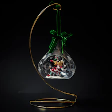 a glass ornament with a christmas scene inside of it