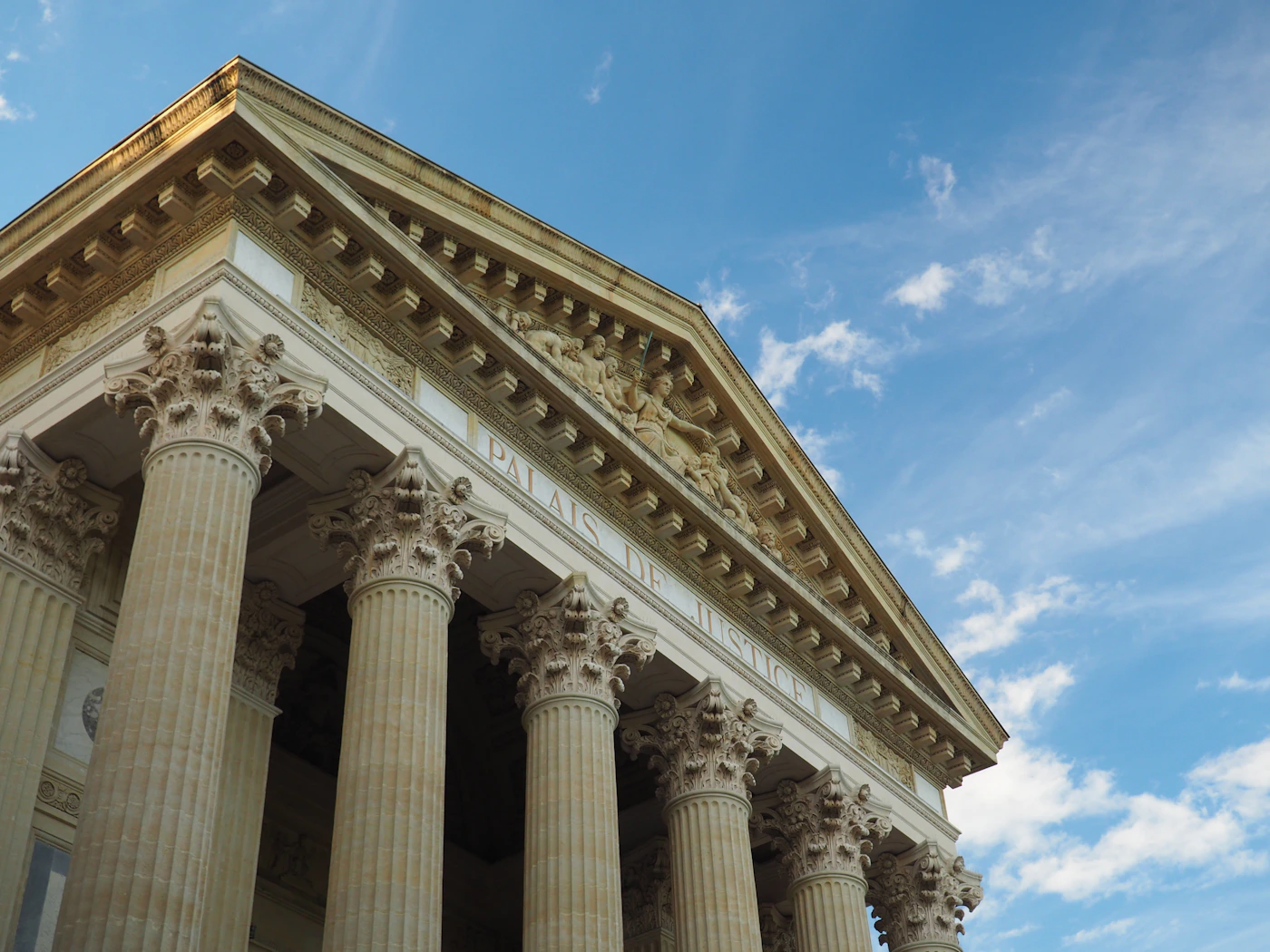 Tall courthouse columns against a clear sky, representing the federal courts where maritime claims are decided