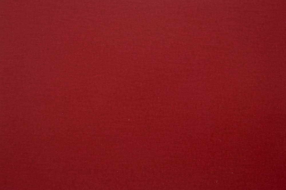 a close up of a red background with a black border