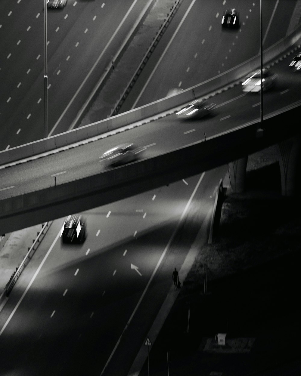 a black and white photo of a highway