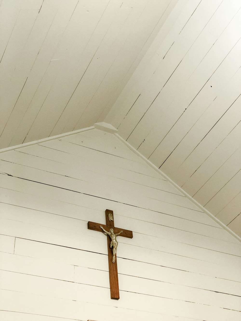 a cross on the wall of a church